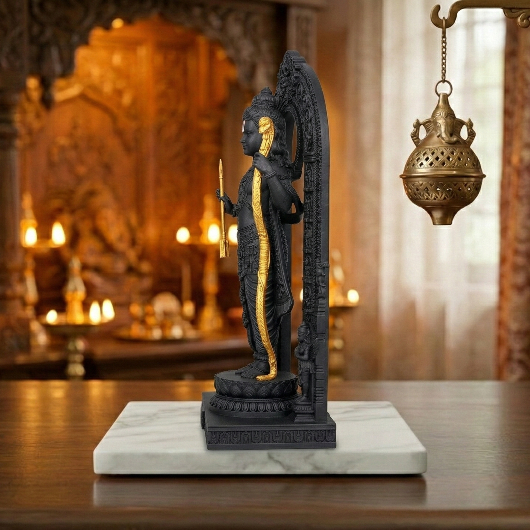 ram lalla statue on a marble base with a blurred background of candles and decor.